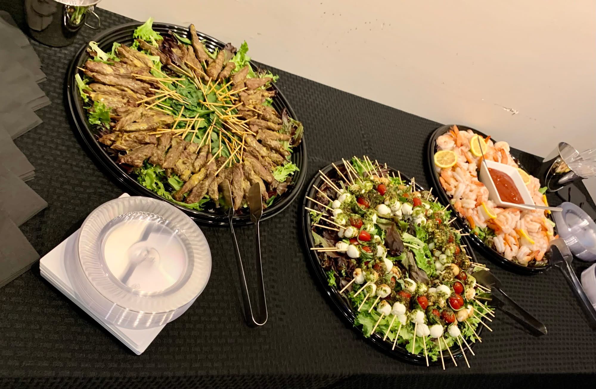 Appetizer platters with skewers and shrimp